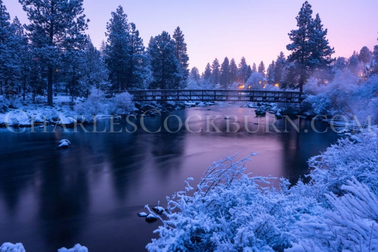 The Deschutes River with snowy banks in the early morning light